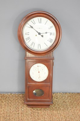 Lot 440 - A Howard Miller reproduction wall clock, key...
