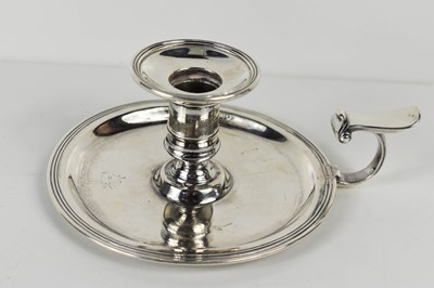 Lot 134 - A 19th white metal chamber stick, with thumb...