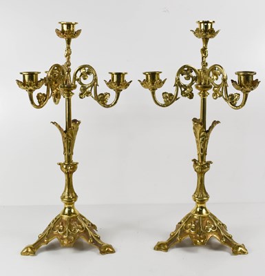 Lot 497 - A pair of early 20th century gilt brass four...