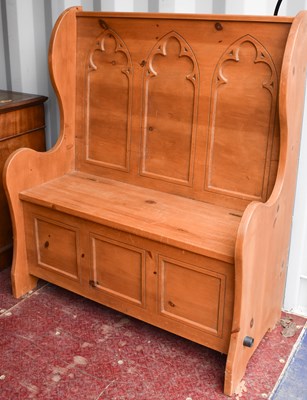 Lot 471 - A pine box seat settle with Gothic style...
