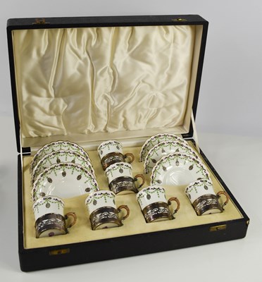 Lot 225 - A cased set of Royal Worcester coffee cans and...