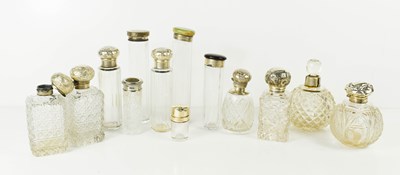 Lot 141 - A group of silver and plated topped dressing...