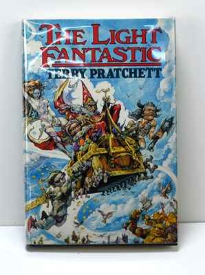 Lot 362 - A signed copy of The Light Fantastic by Terry...