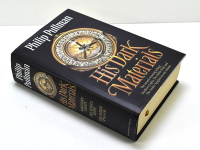 Lot 363 - A signed copy of His Dark Materials by Philip...