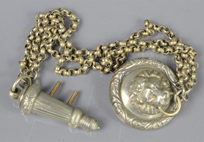 Lot 466 - A Victorian lion headed cross belt whistle and...
