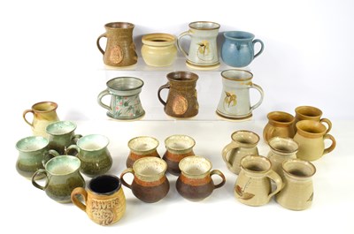 Lot 32 - A group of studio pottery mugs to include...