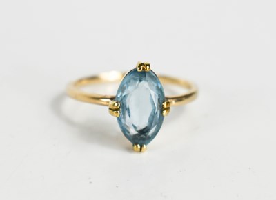 Lot 104 - A blue paste set dress ring, the oval stone of...