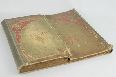 Lot 384 - An Edwardian postcard album with various...