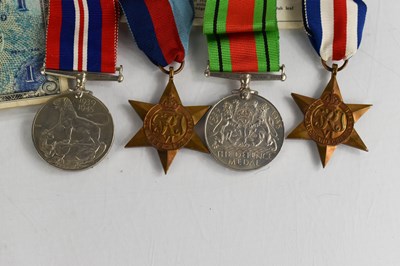 Lot 455 - A WWII medal group including Campaign stars,...