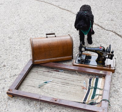 Lot 341 - A vintage singer sewing machine and loom