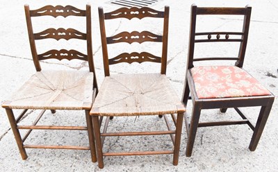 Lot 593 - Two early 19th century ladder back chairs with...