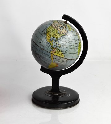 Lot 390 - A miniature vintage metal table globe, 20cm high.