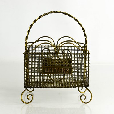 Lot 344 - A vintage brass table letter rack, 18cm high.