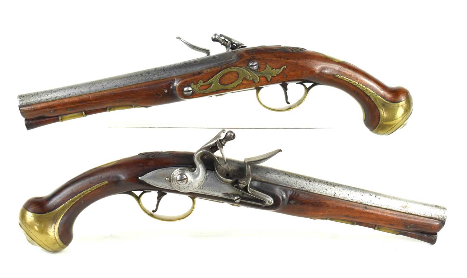 Lot 12 - A pair of 18th century flintlock pistols, the...