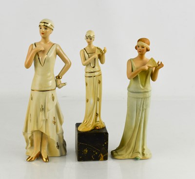 Lot 374 - Three Art Deco porcelain figurines, one raised...