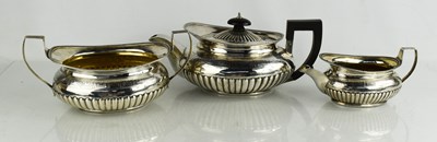 Lot 290 - A George III three piece silver tea set...