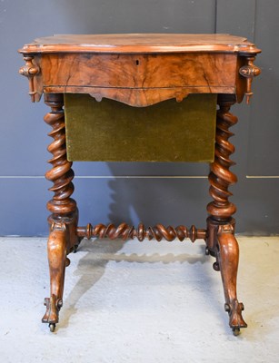 Lot 651 - A Victorian figured walnut work box and sewing...