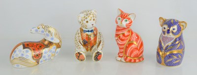 Lot 126 - A group of four Royal Crown Derby paperweights,...