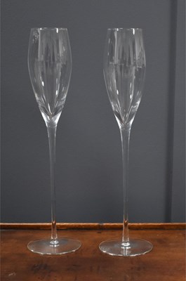 Lot 91 - A pair of tall crystal champagne flutes, the...