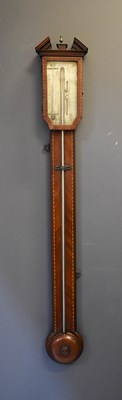 Lot 324 - A George III mahogany stick barometer, the...
