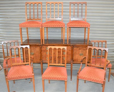 Lot 662 - A 20th century yew wood dining room suite to...