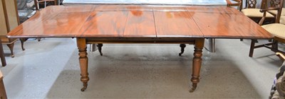 Lot 647 - A Victorian mahogany dining table on turned...