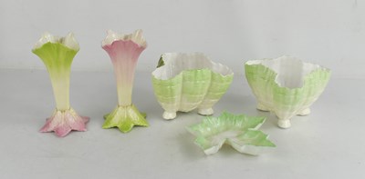Lot 43 - A pair of Royal Worcester spill vases, in...