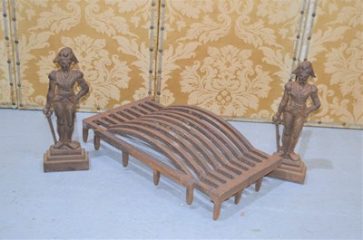 Lot 406 - A cast iron fire grate of curved griddle form,...