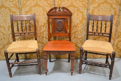 Lot 598 - A Victorian hall chair, the back carved with a...