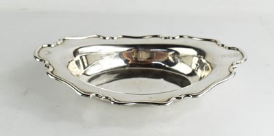 Lot 280 - An Edwardian silver dish with scroll edge...