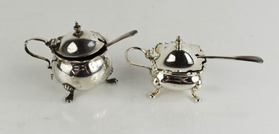 Lot 252 - Two silver mustard pots and covers, both with...