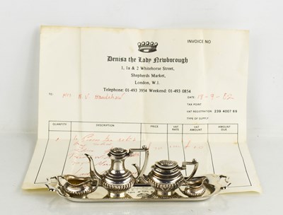 Lot 276 - A silver miniature four piece tea set and tray,...
