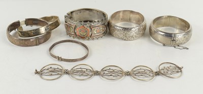 Lot 371 - A silver bracelet of five circular panels with...