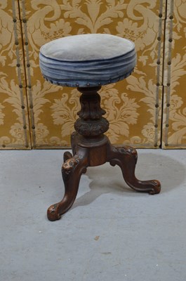 Lot 599 - An Edwardian piano stool upholstered in blue...