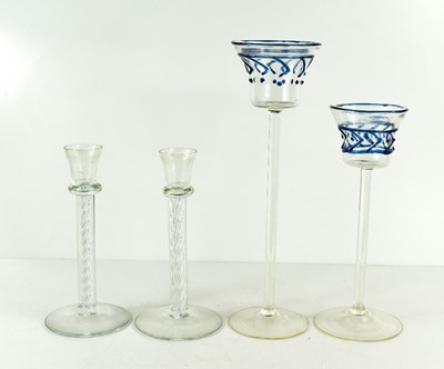 Lot 38 - A pair of Kosta Boda spiral stem candlesticks,...