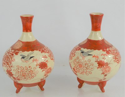 Lot 404 - A pair of Japanese Kutani style vases raised...