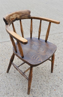 Lot 544 - A Victorian elm smokers bow armchair
