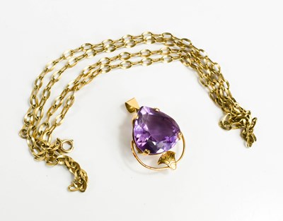 Lot 45 - An amethyst set pendant, the single trillion...