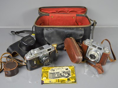 Lot 454 - A Zorki 4K vintage 35mm camera together with a...
