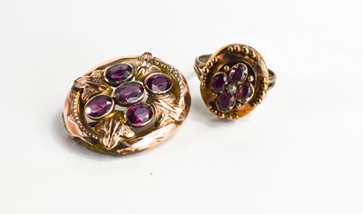 Lot 38 - A rose gold (unmarked) and amethyst oval...