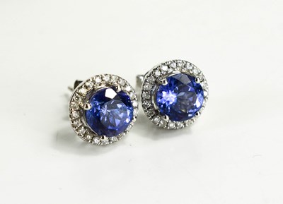 Lot 13 - A pair of tanzanite and diamond 18ct white...