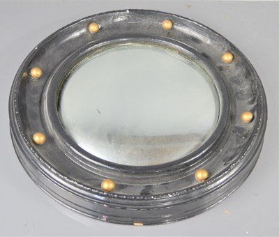Lot 377 - A Victorian porthole convex mirror, black frame.
