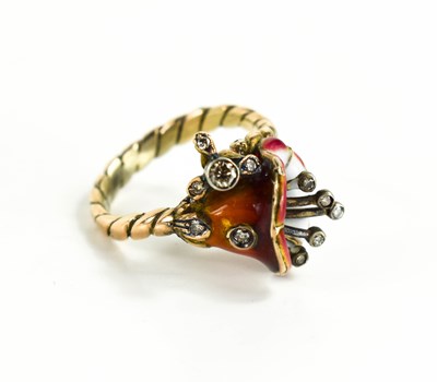 Lot 2 - A gold, enamel and diamond ring in the form of...