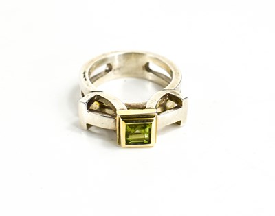 Lot 29 - A silver and parcel gilt ring, set with an...