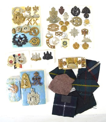 Lot 37 - A group of cap and collar badges, including a...