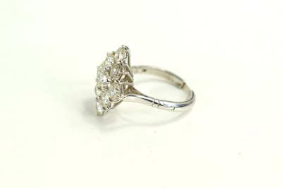 Lot 18 - A white gold and diamond ring set with nine...