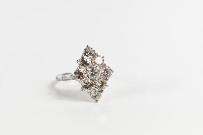 Lot 18 - A white gold and diamond ring set with nine...