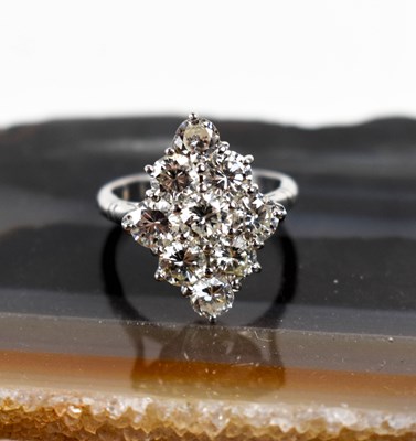 Lot 18 - A white gold and diamond ring set with nine...