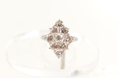 Lot 18 - A white gold and diamond ring set with nine...