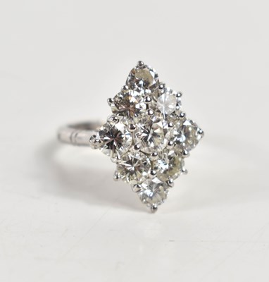 Lot 18 - A white gold and diamond ring set with nine...